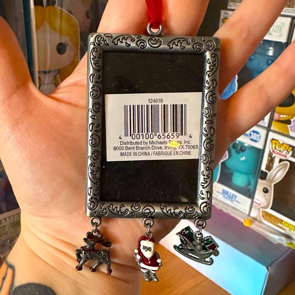 FREE with purchases $15+ . Cute mini metal frame w/ dangling Xmas characters